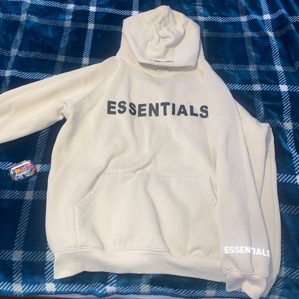 Fear of God Essentials hoodie in cream/off-white. Size M